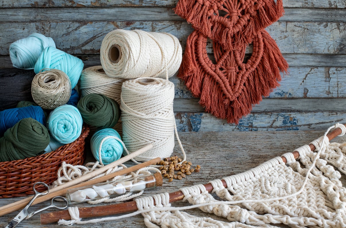 Weaving macrame at home.