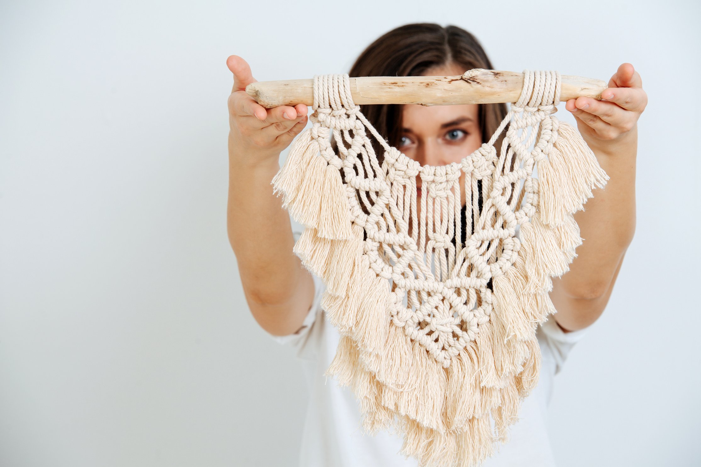 The girl shows macrame on her hand